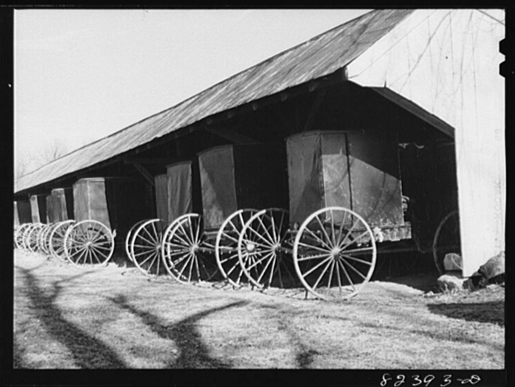 Hinkletown, Pennsylvania (vicinity). Carriages standing under shed outside Mennonite church.jpg